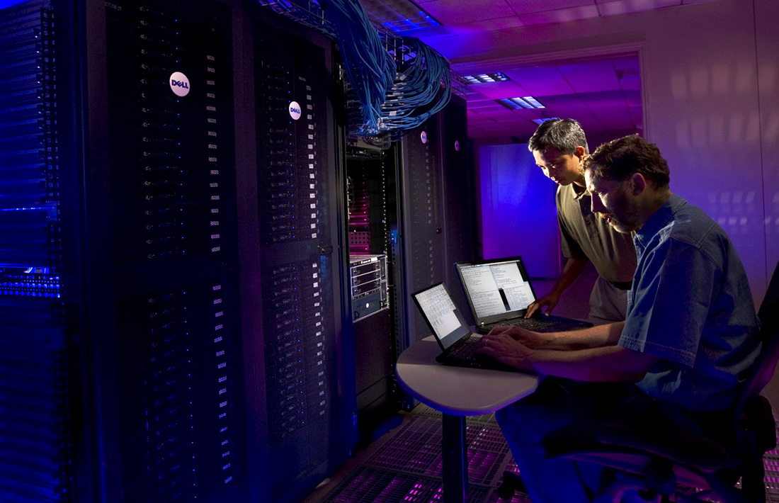 IT professionals working with server infrastructure inside a data center