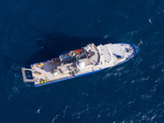 Overhead image of a boat floating in the ocean