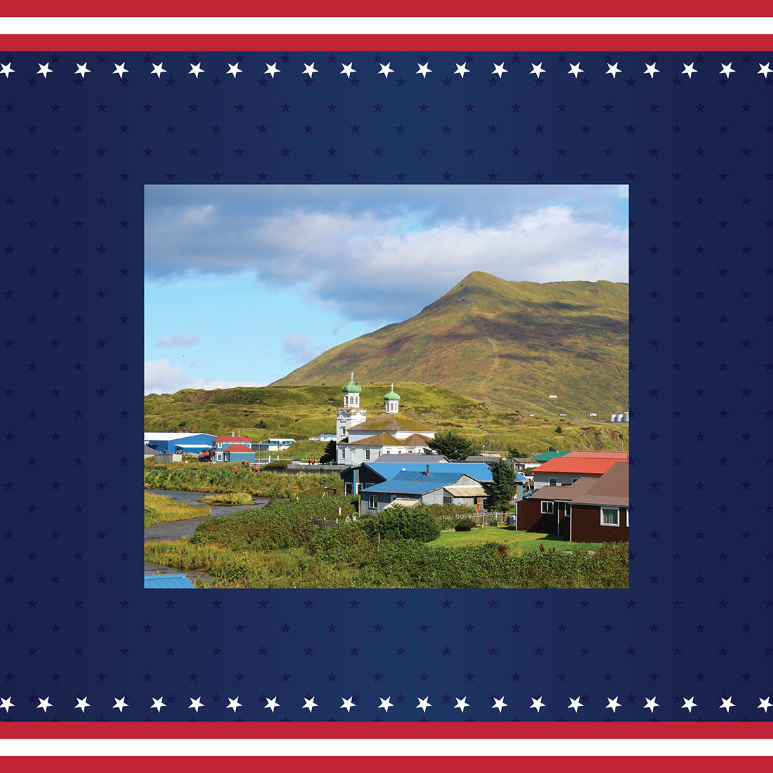 Town in Alaska, featuring rolling green hills and colorful buildings