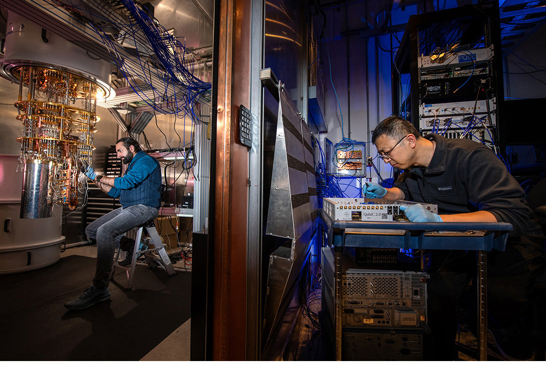 Two engineers work in lab