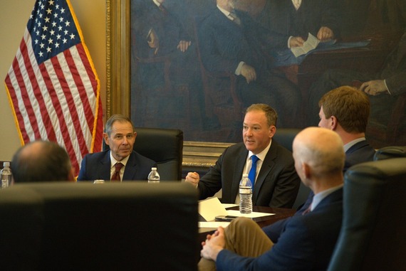 Administrator Zeldin sitting at a table with other government officials.