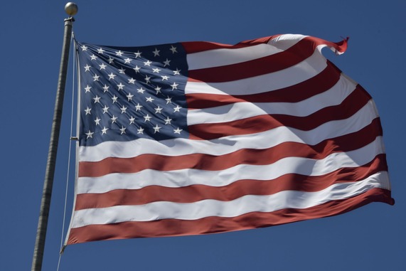 American flag blowing in the wind.