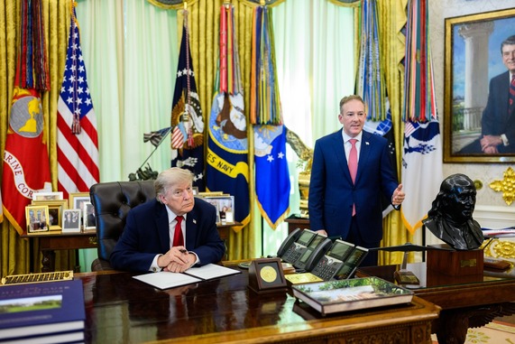 Administrator Zeldin standing at the resolute desk with President Trump.