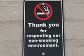 a sign reading "Thank you for respecting our non-smoking environment"
