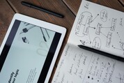 notepad and iPad stock photo