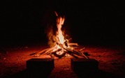 campfire in the dark stock photo