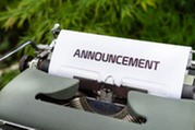typewriter with the word "announcement" on paper