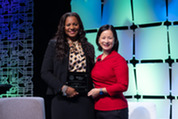 Darlene Bullock (left) accepts the small business and procurement equity award from Christine Harada (left)