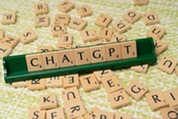 The word "chatgpt" spelled out in scrabble tiles