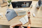 Top view photo of person watching online training through an iMac