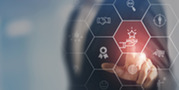 Business professional selects a star icon on a digital interface surrounded by symbols for goals, awards, customers and collaboration.