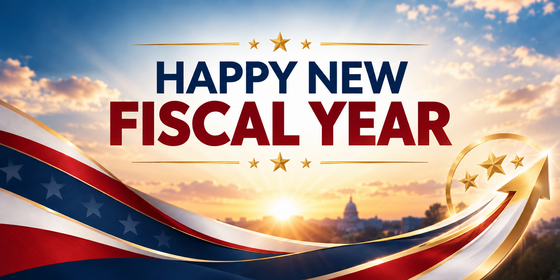 Patriotic banner with sunrise, red-white-blue ribbons, gold stars and arrow, and text reading “Happy New Fiscal Year.”