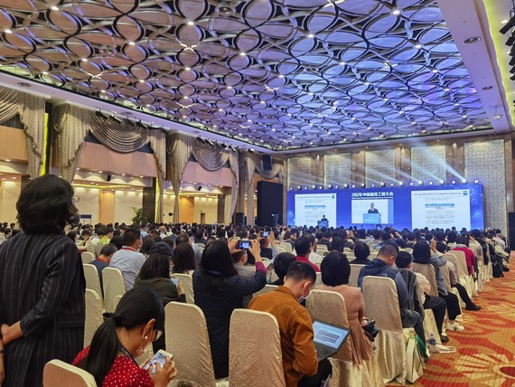 image of a conference room with attendees