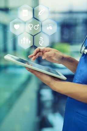 Health care worker with stethoscope and tablet computer