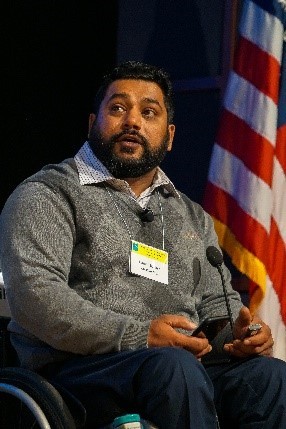 Male patient in wheelchair speaking at the  February 2020 workshop