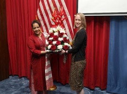 image of Letitia Robinson being presented a gift by Sarah McMullen