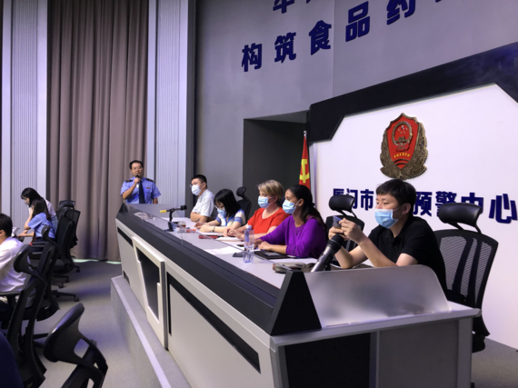 Mathern sitting on a panel in China