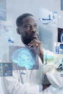 A man in a lab coat analyzing data.