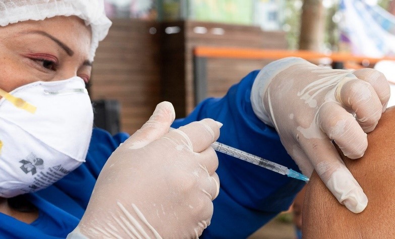 medical professional administering a vaccine