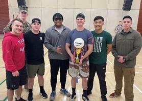 group of marines with dodgeball trophy