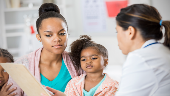 parent, child and health care provider talking
