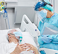 Health care professionals care for a hospitalized patient