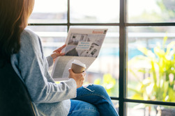 Woman reading a newspaper