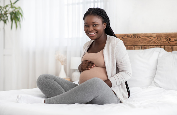 Happy expectant Black woman