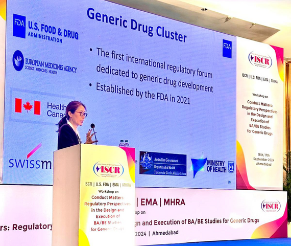 Symposium background banner with speaker in front