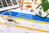 Mortgage application, keys and a calculator