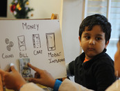 young boy learning about finances