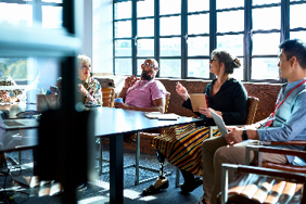 diverse group at conference table discussion