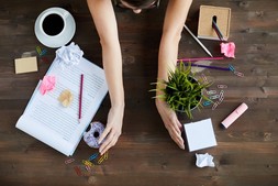 woman clearing desk clutter