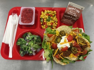 School lunch tray: Taco salad, Mexicali Corn, and Broccoli Salad