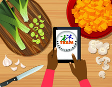 A person's hand using a tablet to access Team Nutrition's website with surrounding recipe ingredients