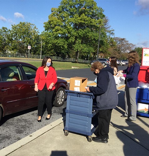 USDA FNS Administrator Pam Miller helps pass out school meals at Lebanon High School in Pennsylvania