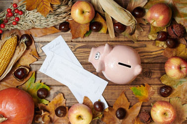 Fall Background with shopping list and piggy bank