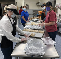 School Nutrition Professionals preparing school meals to go