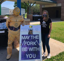 School Nutrition Professionals dressed in costume for school meal pickup 