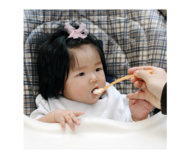 Infant Eating in High Chair
