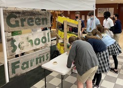 Students at Pius X High School played games and learned more about local produce during their visit from Green School Farms.