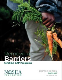 Cover page of the NASDA "Removing Barriers" toolkit, which includes a man carrying two freshly picked carrots. 