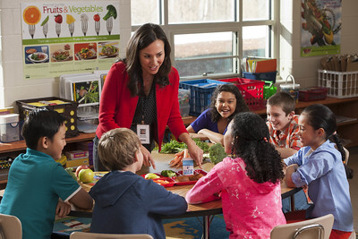 Teacher providing nutrition education to students