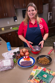 a tribal nutrition educator with ingredients for a cooking demo