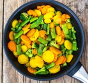 blend of carrots, broccoli, and green beans in a pan