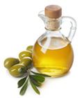 olive oil bottle next to olives
