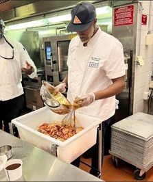 Chef preparing chicken at St. Paul Public Schools