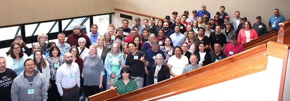 Large group of conference attendees lined up on a stairwell