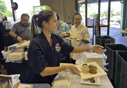 Student handing out food samples