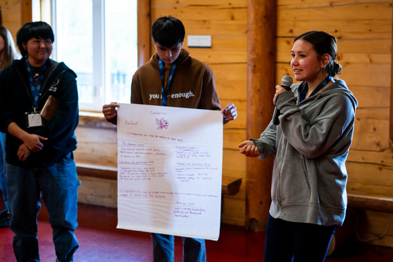 Three students presenting at the Youth Summit in Alaska. 